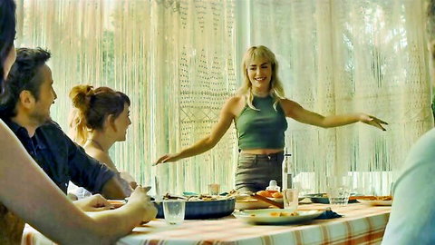 Veronica Sanchez smiling in green top at dinner table Sky Rojo scene