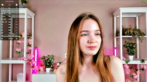 Freckled redhead teen webcam girl smiling with small tits in skimpy top