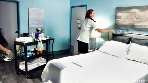 Alex Coal as sexy redhead housekeeper in uniform, dusting bed teasingly