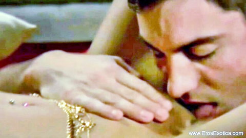 Exotic Indian woman with gold jewelry and navel piercing gets breast kissed in erotic scene