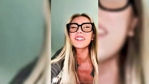 WettMelons blonde with glasses smiling seductively in jacket