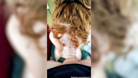 POV hands gripping sexy redhead's wild curly hair during blowjob.