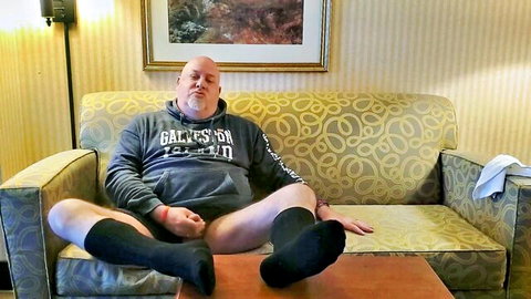 Kennie Jai masturbating in black OTC socks in motel room