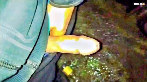 Escort exposing erect cock outdoors at night in green pants