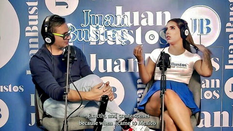Sexy Latina babe in short blue skirt and crop top during flirty interview with Juan Bustos
