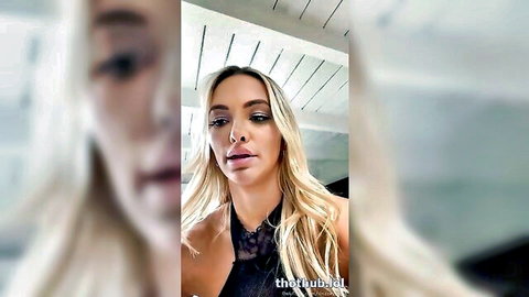 Lindsey Pelas blonde bombshell in black lace top, teasing cleavage on OnlyFans