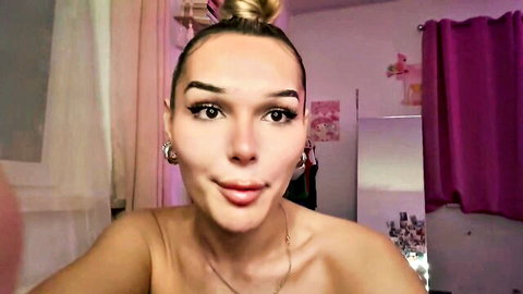 Topless Slavic trans woman with ponytail pouting in seductive selfie