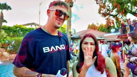 Ryan Pownall at lively summer pool party with smiling redhead woman