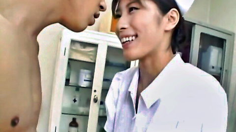 Smiling Asian nurse in uniform leaning close to shirtless man