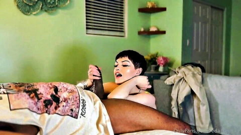 Petite goth girl in fishnets spreads shaved pussy for black man's thick thigh in interracial missionary.