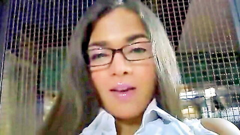 Camilla Jolie Italian transsexual in glasses and open shirt, seductive pose