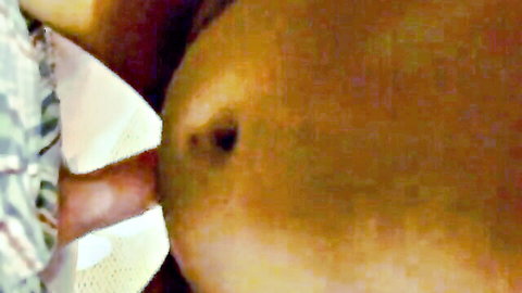 Closeup of curvy ebony babe's exposed pregnant belly and deep navel tease