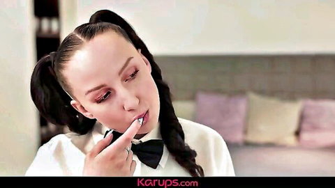 Busty teen Bella Angel licks spoon seductively in schoolgirl outfit