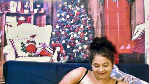 Indianstar75 mature brunette with big tits smiling in Christmas setting
