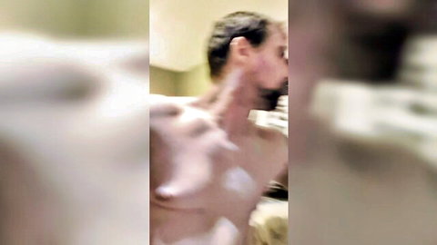 Blurry amateur closeups of nude gay man's exposed chest and nipples