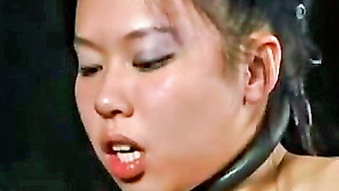 Asian woman in BDSM collar, mouth open in ecstasy, Insex Sahara and Koko scene