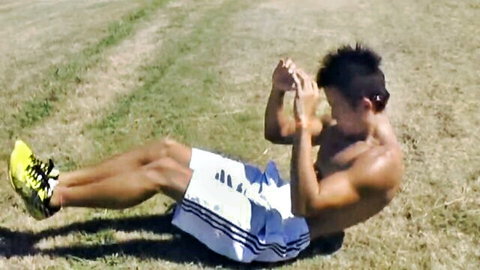 Shuji Okada, intense Japanese stud flexing in Adidas shorts during outdoor workout