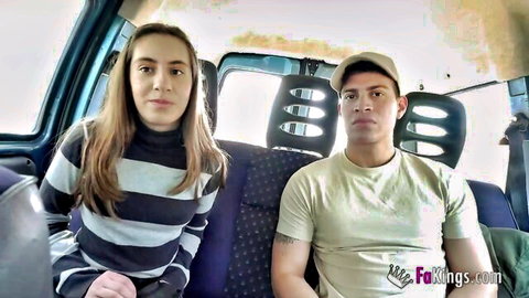Brunette teen babe in striped sweater sits with guy in car van interior