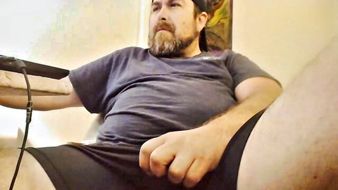 Bearded chubby man in t-shirt and shorts, teasing in gay amateur POV setup