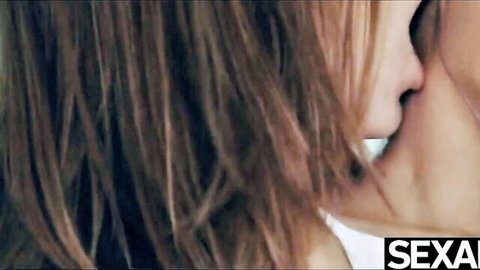 Two sexy brunettes passionately kissing in intense close-up lesbian makeout