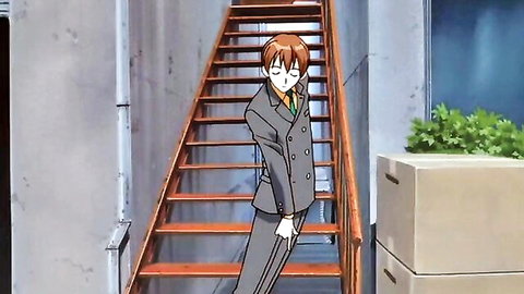 Anime redhead boy in gray suit leaning thoughtfully on wooden stairs