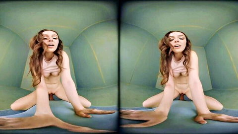 Brunette babe with long hair sits legs spread wide exposing shaved pussy and perky tits in green dome room