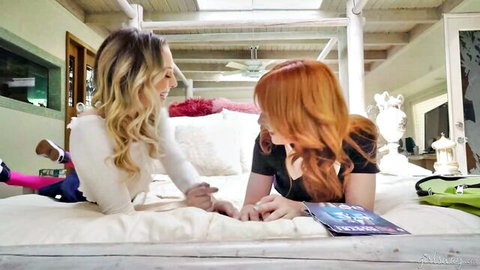 Lacy Lennon and Lily Larimar as nerdy girls reading comic on bed