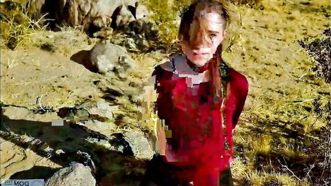 Slim woman with braided hair in red outfit outdoors in desert