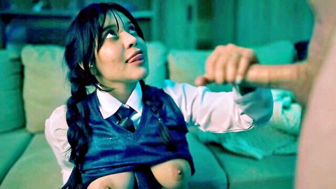 Brunette schoolgirl cosplay with big tits exposed teases thick cock with open mouth on couch
