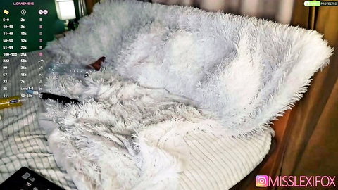 Webcam babe MissLexiFox fingers her wet glistening pussy on fluffy white bed
