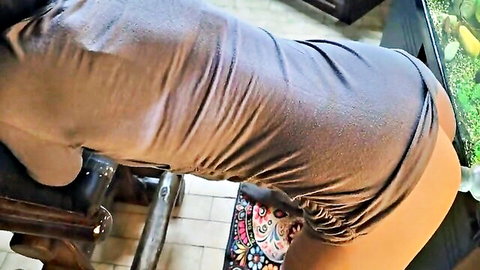 Amateur babe bends over wooden chair pulling up gray dress exposing bare juicy ass cheeks
