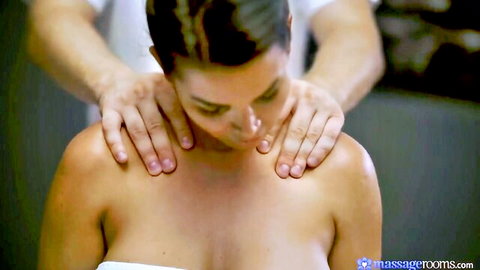 Chloe Amour topless massage on bare shoulders in erotic spa scene