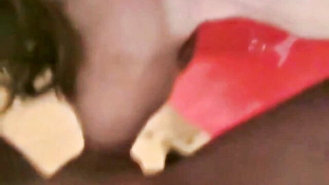 Woman gagging on thick red dildo deepthroating with stretched lips and bulging cheeks