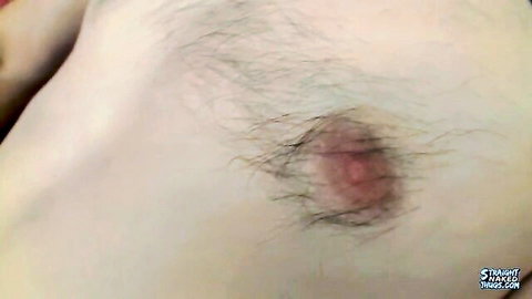 Close-up of fit horny guy's hairy erect nipple during solo jack off