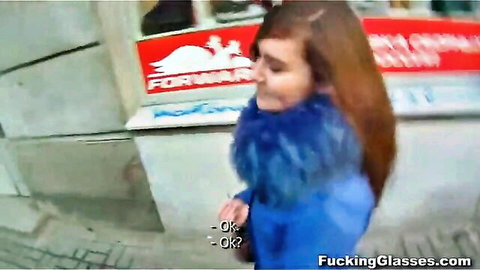 Sexy brunette with glasses in blue fur jacket smiling outdoors on FuckingGlasses