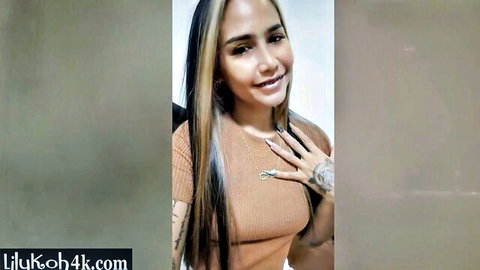 Cute Asian Lily Koh poses smiling, squeezing small tits for viewers