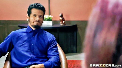 Latino man in blue shirt sits facing busty purple-haired woman in office roleplay scene