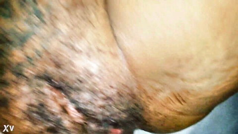 Youthful black MILF creampie close-up with semen dripping from hairy pussy