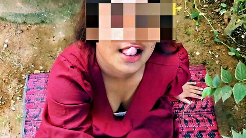Sri Lankan Indian woman in red top teases with tongue out and deep cleavage