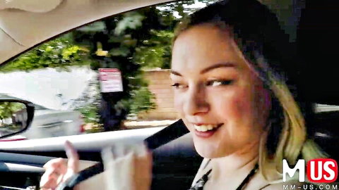 Blonde Amber Moore smiling in car during stranger pickup scene