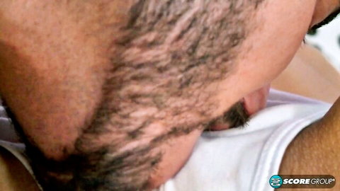 Bearded man's ecstatic face with eyes closed and mouth open during intense blowjob closeup