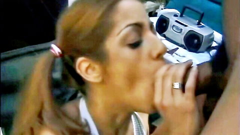 Hot brunette in bikini giving blowjob in interracial gangbang