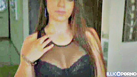Brunette babe in sheer black mesh top exposing huge tits and deep cleavage tease