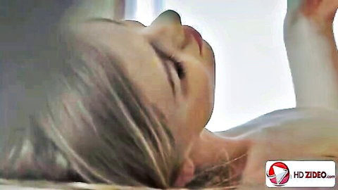 Lolly Gartner blonde model lying nude in ecstasy, close-up side view