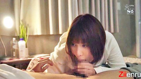 Short-haired Asian woman passionately sucking thick cock on hotel bed with handjob grip