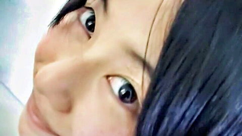 Cute Japanese teen Ami smiling sideways close-up from JAV thumbnail