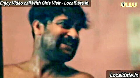 Shirtless bearded Indian man grimaces in intense pleasure during blowjob closeup