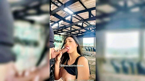 Asian beauty in black top performing oral sex on man