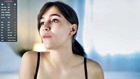 Petite teen webcam girl with small natural tits in black bra pouting seductively
