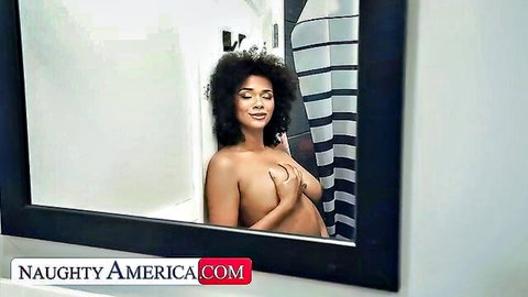 Naked ebony beauty covers her perky tits smiling in steamy bathroom mirror